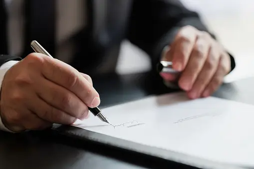 An entrepreneur signing a contract